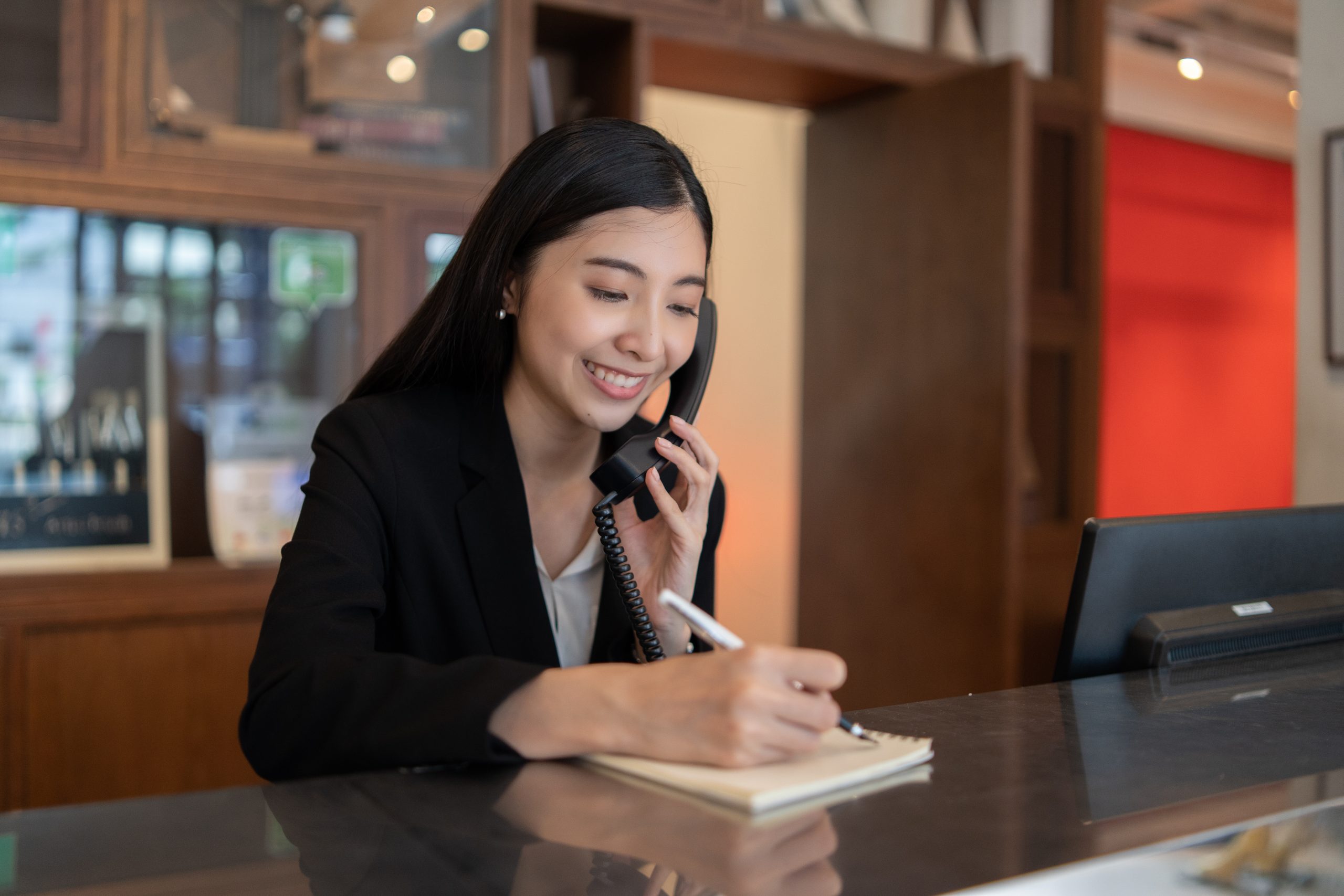 Welcome to the hotel,Happy young Asian woman hotel receptionist